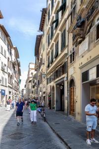 people walking down a street at Guesthouse Bel Duomo in Florence