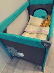 a childs bed with a shark and stuffed animals in it at Apartamenty Copernicus - zameldowanie 24 h in Toruń
