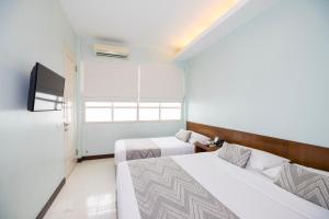Lova arba lovos apgyvendinimo įstaigoje Tanaya Bed & Breakfast