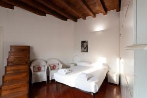Posteľ alebo postele v izbe v ubytovaní Anfiteatro Apartment in Brera