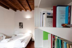 Posteľ alebo postele v izbe v ubytovaní Anfiteatro Apartment in Brera