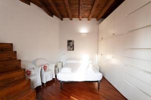 Posteľ alebo postele v izbe v ubytovaní Anfiteatro Apartment in Brera