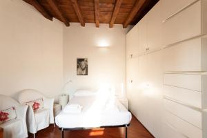 Posteľ alebo postele v izbe v ubytovaní Anfiteatro Apartment in Brera