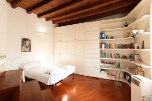 Posteľ alebo postele v izbe v ubytovaní Anfiteatro Apartment in Brera