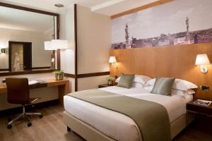 Postel nebo postele na pokoji v ubytování Starhotels Ritz