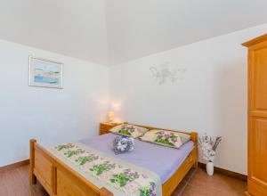 Postel nebo postele na pokoji v ubytování Vila Maslinica