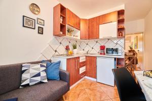 Kuchyň nebo kuchyňský kout v ubytování Apartments Noa