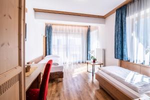 Voodi või voodid majutusasutuse Hotel Residence Rose toas