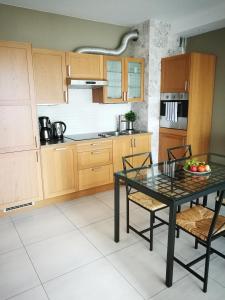 Kuchyň nebo kuchyňský kout v ubytování Apartament Sunrise Spacerowa by Noclegi Renters
