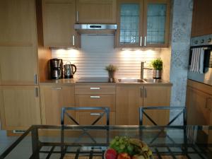 Kuchyň nebo kuchyňský kout v ubytování Apartament Sunrise Spacerowa by Noclegi Renters