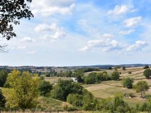 a view of the countryside from a hill at Spacious Holiday Home with Swimming Pool in Cuzy in Cuzy