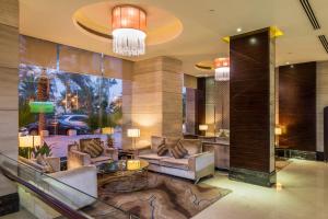 a lobby of a hotel with couches and tables at Boudl Al Qasr in Riyadh