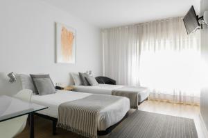 Postel nebo postele na pokoji v ubytování Hotel Umu