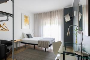 Postel nebo postele na pokoji v ubytování Hotel Umu