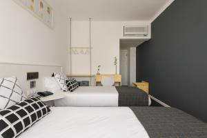 Postel nebo postele na pokoji v ubytování Hotel Umu