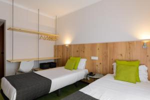 Postel nebo postele na pokoji v ubytování Hotel Umu