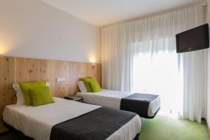 Postel nebo postele na pokoji v ubytování Hotel Umu