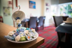 a plate of food on a table with a mirror at DUNVEGAN in Windermere