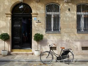 a bike parked in front of a building at Hotel Collect - Adults Only in Budapest