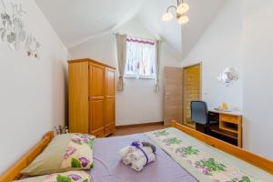 Postel nebo postele na pokoji v ubytování Vila Maslinica + 37 fotografií