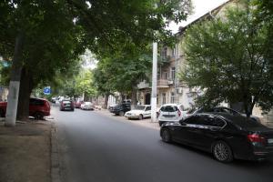 a black car parked on the side of a street at Odessa Heart in Odesa