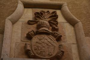 a stone sculpture of a bird on the side of a building at La Posada de Chinchilla in Chinchilla de Monte Aragón