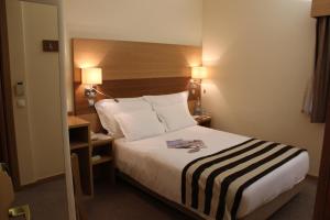 Cama o camas de una habitación en Hotel Principe Lisboa