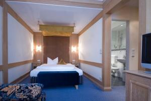 Postel nebo postele na pokoji v ubytování Hotel Post