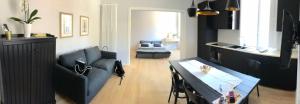 a living room with a couch and a table at Belsiana Luxury Apartment in Rome
