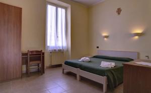 Posteľ alebo postele v izbe v ubytovaní Soggiorno Marino San Giuseppe