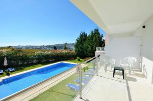 a view of a swimming pool from a house at HILLTOP OASIS Lisboa Oeiras in Oeiras