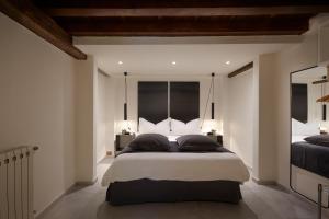 Posteľ alebo postele v izbe v ubytovaní MDR Duomo Apartment