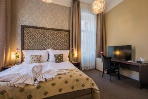 Posteľ alebo postele v izbe v ubytovaní Wellness & Spa hotel Villa Regenhart