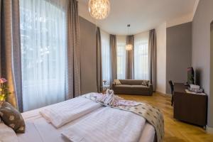 Posteľ alebo postele v izbe v ubytovaní Wellness & Spa hotel Villa Regenhart