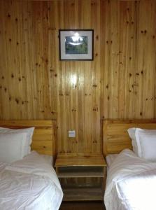 Cama o camas de una habitación en Guilin Longsheng Wisdom Inn