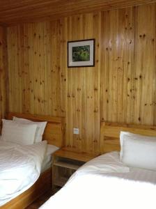 Cama o camas de una habitación en Guilin Longsheng Wisdom Inn