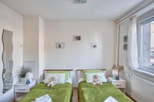 Postel nebo postele na pokoji v ubytování Apartment U Medvídka