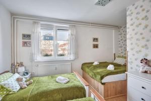 Postel nebo postele na pokoji v ubytování Apartment U Medvídka