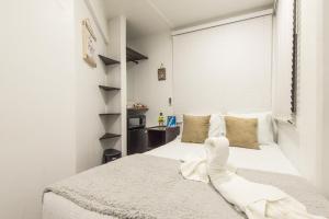 Cama ou camas em um quarto em Hotel Las Lunas