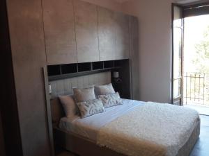 Posteľ alebo postele v izbe v ubytovaní Appartamento Magnolia