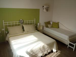 Säng eller sängar i ett rum på Il Marrondindo Bed & Breakfast