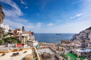 an aerial view of a city with the ocean at La casa del capitano in Atrani