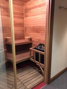 a sauna with wooden walls and a wooden floor at Hotel Gasthof Gramshammer in Vail