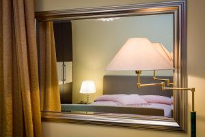 A bed or beds in a room at Diamond Apartment