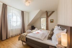 Posteľ alebo postele v izbe v ubytovaní Wellness & Spa hotel Villa Regenhart