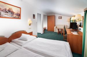 Posteľ alebo postele v izbe v ubytovaní Hotel Spindlerova Bouda