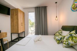 Ένα ή περισσότερα κρεβάτια σε δωμάτιο στο Linden Apartments