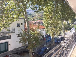 a view from the balcony of a building at Pensão Estrela in Unhais da Serra