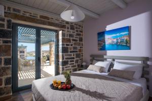 A bed or beds in a room at Mandy Luxury Villa by Cretevasion