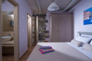 A bed or beds in a room at Mandy Luxury Villa by Cretevasion